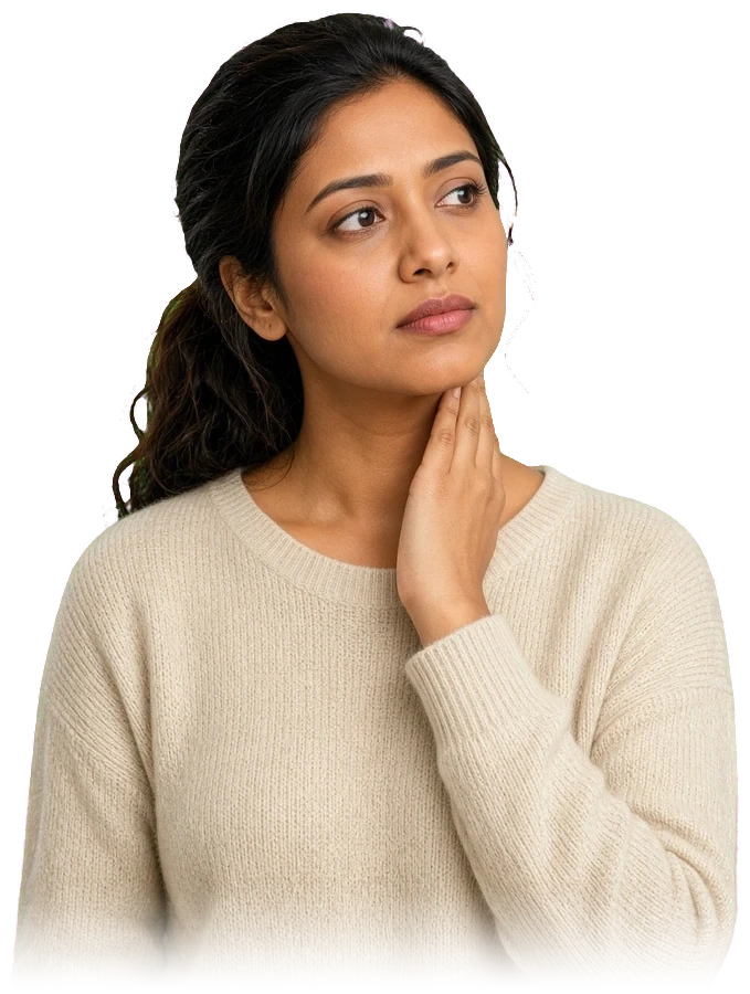 A woman with a hand at her throat, noticing something has changed